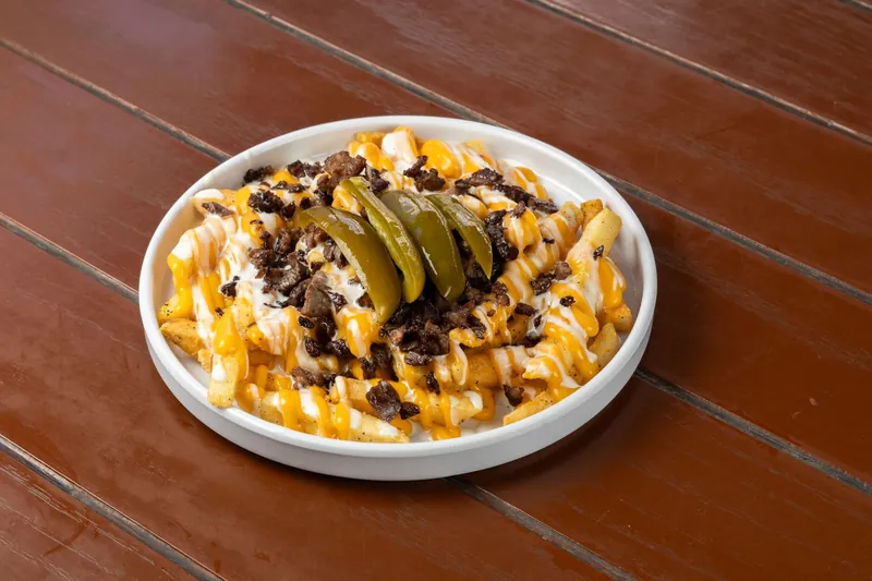 Chips topped with melted cheese, beef and jalapeños